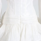 White langry cotton summer dress with ruffled hem and back zipper