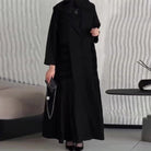 Black fringed high-neck dress in langry trench coat fashion