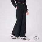 Black loose fitness warm pants with elastic waistband and pockets