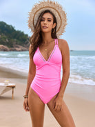 Hot pink one-piece swimsuit with white trim and v-neckline from Langry fashion ملابس