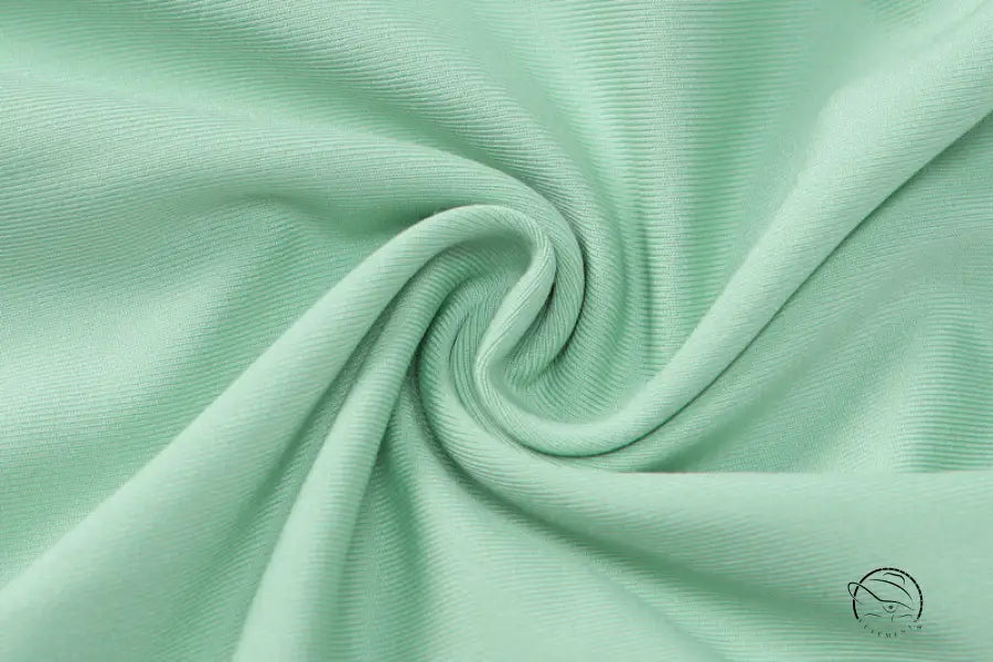 Mint green swirling pattern on backless slim fit jumpsuit