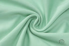Mint green swirling pattern on backless slim fit jumpsuit