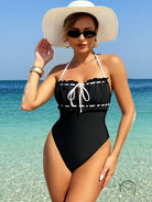 White black halter one-piece swimsuit with ruffle trim and tie detail
