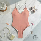 Stunning matching sling swimwear in peach ribbed one-piece with criss-cross straps