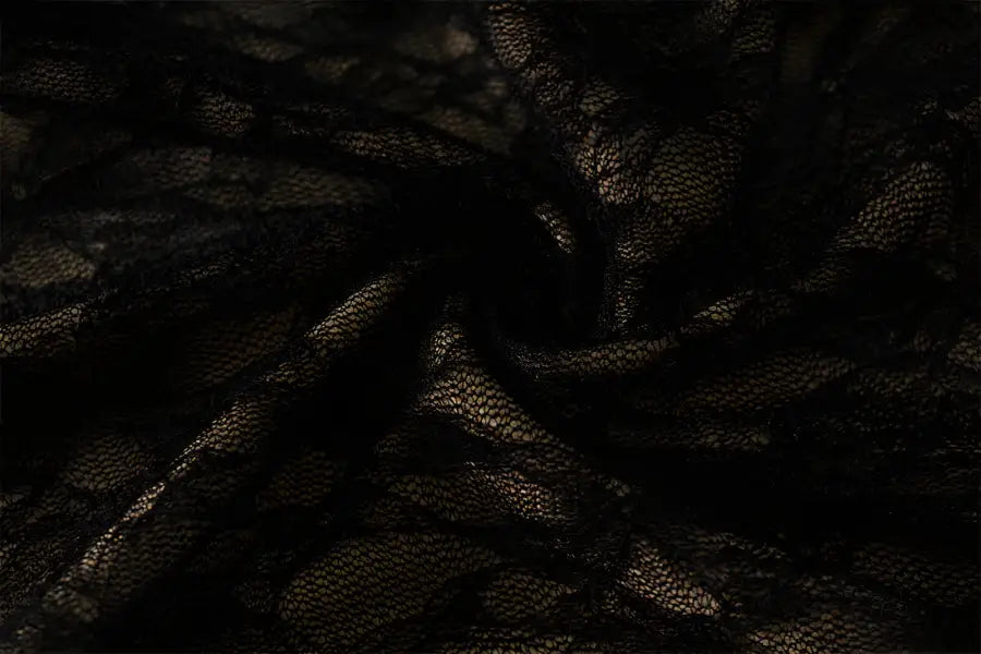 Stunning pure lace dress in dark textured fabric with swirling folds