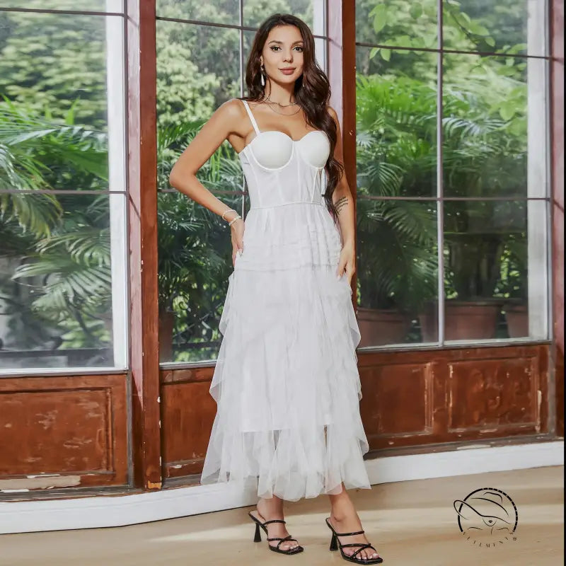 White tiered tulle French tube dress with white yarn straps and large swing