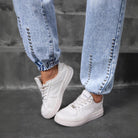 Light-wash denim jogger jeans with silver stud embellishments, perfect match beaded straight style