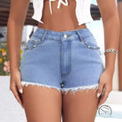 Slimming frayed beaded jeans shorts in light blue denim with frayed hems and studded pockets