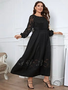 Elegant lace dress with black floral accents, maxi style