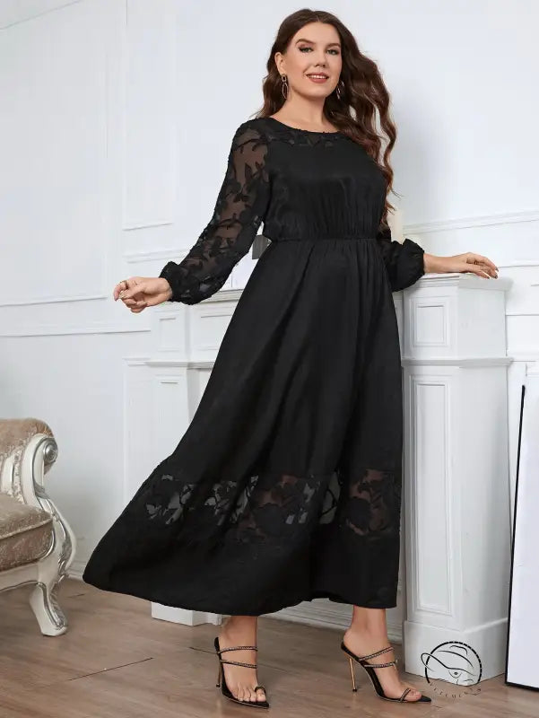 Elegant lace dress with black floral accents, maxi style