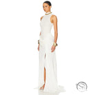 White high-neck gown with high split, tight waist and gold accents