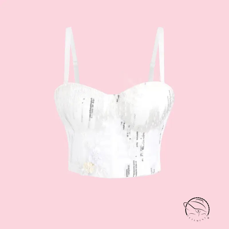 White sequined bustier corset top with thin straps and floral embellishments in Langry fashion