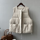 Cream-colored quilted vest with pockets and zipper, ideal for Winter Korean fashion