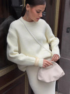 Cream cashmere wool alpaca sweater with balloon sleeves and chain strap bag