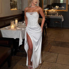 Elegant white strapless split dress showcasing contemporary fashion for casual parties