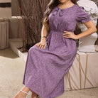 Purple floral midi dress with puff sleeves, perfect for summer fashion from Langry