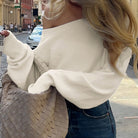 Cream off-shoulder langry fashion top with Bottega Veneta tote