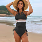 Black halter-neck one-piece swimsuit with striped band and side ties, stylish langry fashion