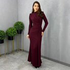 Sleek burgundy long-sleeved maxi dress with draped neckline and fitted silhouette