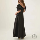 Graceful tube black off-the-shoulder maxi dress with floral accents