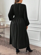 Gorgeous large swing dress: plus-size black long-sleeve with cinched waist and pleated skirt