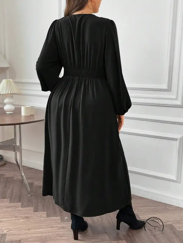 Gorgeous large swing dress: plus-size black long-sleeve with cinched waist and pleated skirt
