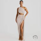 Stunning cutout lace pleated dress with beige one-shoulder crop top and high-slit skirt