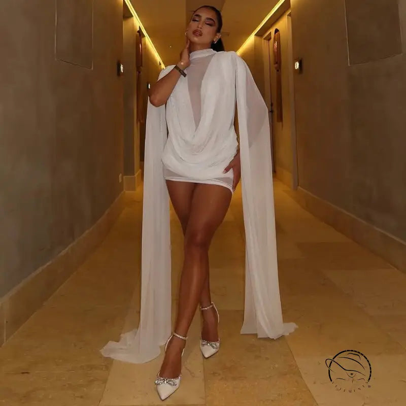 Elegant langry fashion mesh ribbon hip wrapped dress with white sheer cape, gold accents, high-heeled shoes