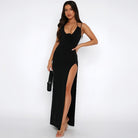 Black halter-neck maxi dress with thigh-high slit, perfect for summer fashion ملابس