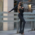 Elegant langry fashion black hooded backless jumpsuit with flared legs and heels