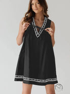 Beautiful embroidered vest denim dress in black with white trim