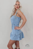 Light blue office suspenders denim dress with front buttons and ruffled hem