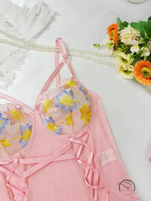 Pink floral lace lingerie set with sheer mesh and crisscross straps in embroidery fashion