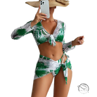 Four piece lace up swimsuit in green white tropical leaves on red flowers background