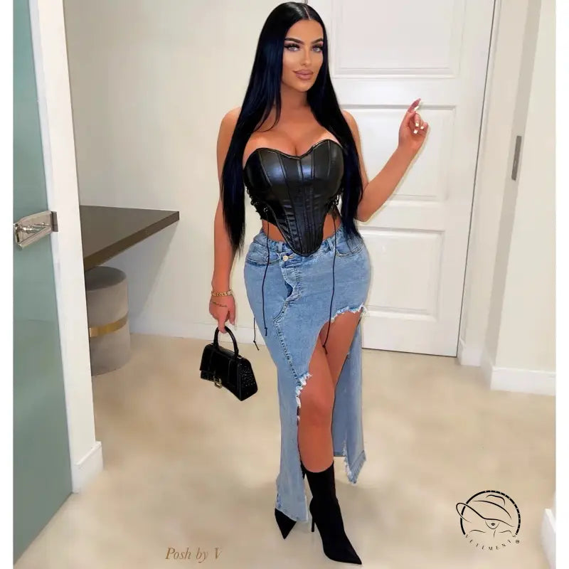 Woman in stunning hip stretch denim long skirt with black corset top and boots