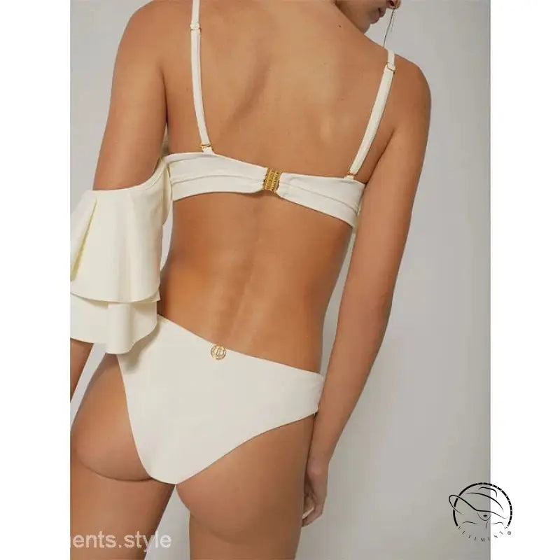 Elegant retro swimsuit in cream with ruffled shoulders