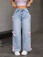 Light blue loose straight leg jeans with pink ribbon accents