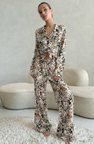 Woman in langry leopard print fashion pajamas set with cardigan