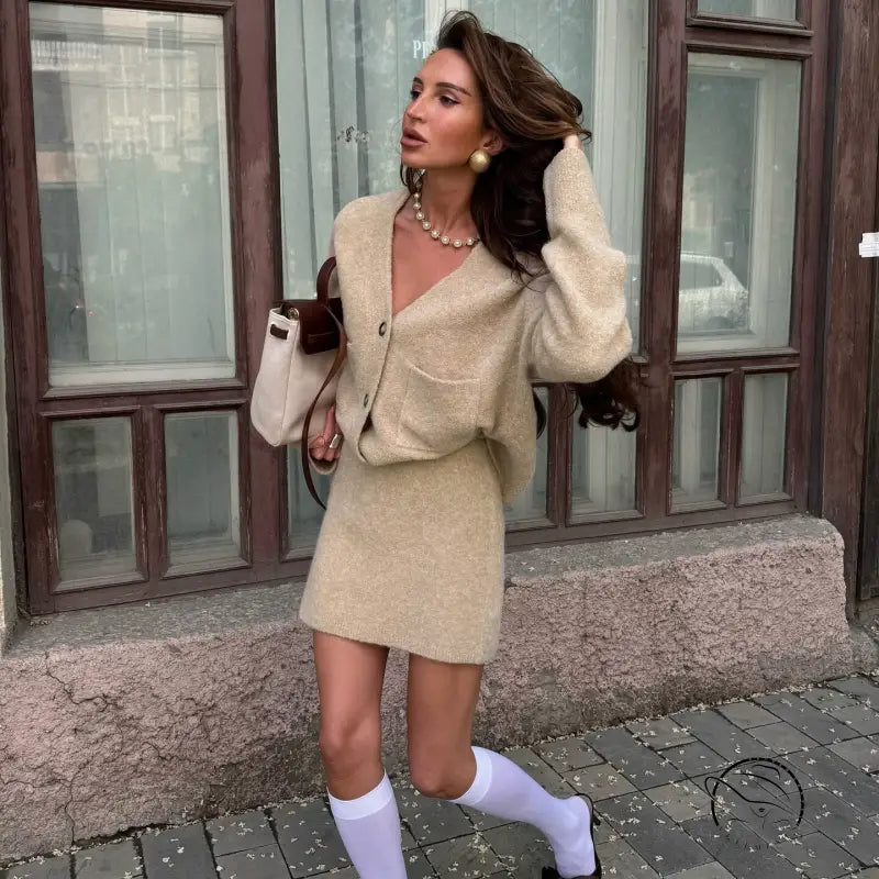 Beige boucle knit langry fashion cardigan with pockets and pearl necklace