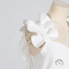 White floral summer slim fit dress with high grade stitching on mannequin