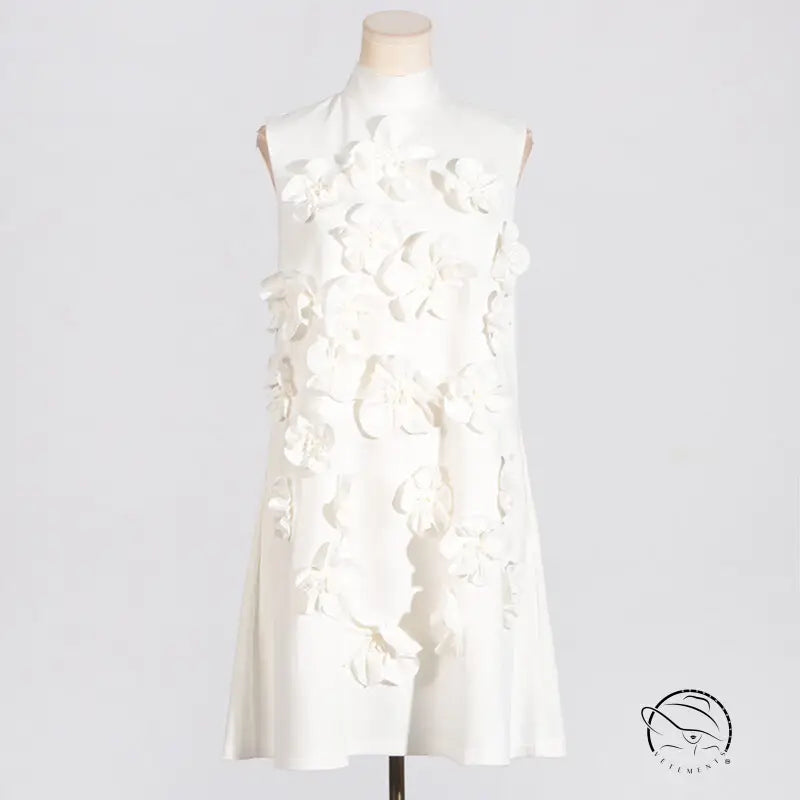 White sleeveless dress with tie bow and 3D floral embellishments