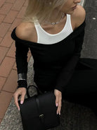 Black leather handbag with flap closure from Langry fashion ملابس