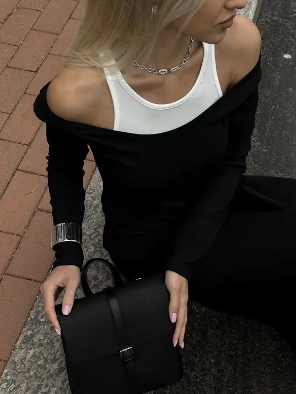 Black leather handbag with flap closure from Langry fashion ملابس