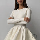 Elegant white long-sleeved beautiful woolen knitted dress