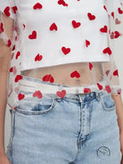 Elegant faux cotton short top with red heart pattern and light wash jeans