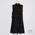 Retro socialite sleeveless black dress with tie bow and floral embellishments