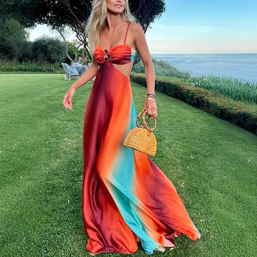 Vibrant rainbow maxi dress with cutout midriff and bow detail for stylish beach fashion