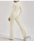 Cream-colored long-sleeve one piece sportswear jumpsuit with flared legs