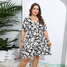 Black and white floral print wrap dress with short sleeves, perfect for casual fashion ملابس