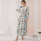 Woman in floral print slim fit maxi dress with blue beige gray patchwork